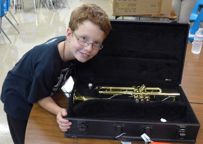A boy and his new trumpet. OMG.